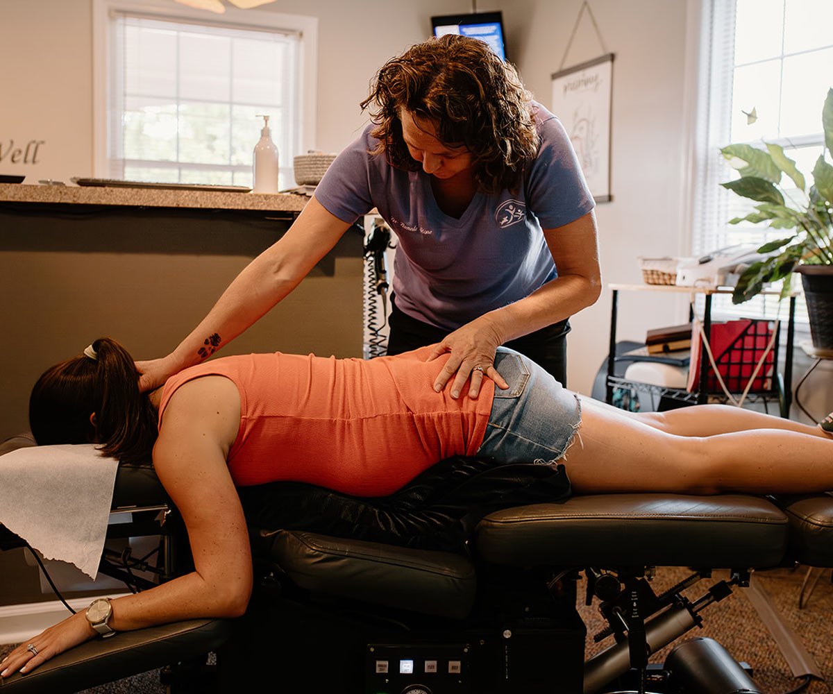 Dr Pam adjusting a patient during pregnancy